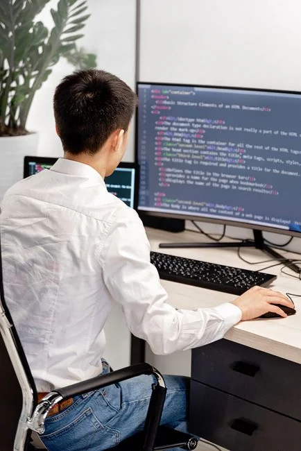 A focused designer works on a user-centric project in a modern office environment.